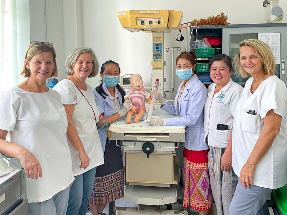 Group photo of six women in hospital uniforms