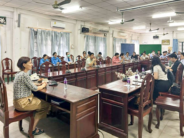 Participants at a seminar in a large meeting room
